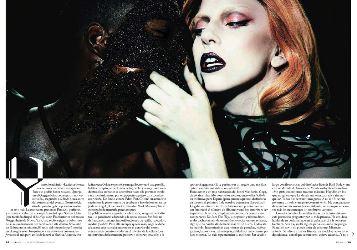 Fashion editorial shot of a light-skinned woman with dark lipstick and a dark-skinned man with a facial covering.