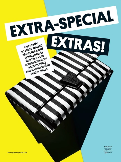 Black and white striped clutch purse on a vibrant background with text overlays promoting 'Extra Special Extras'. Fashion accessory photo.