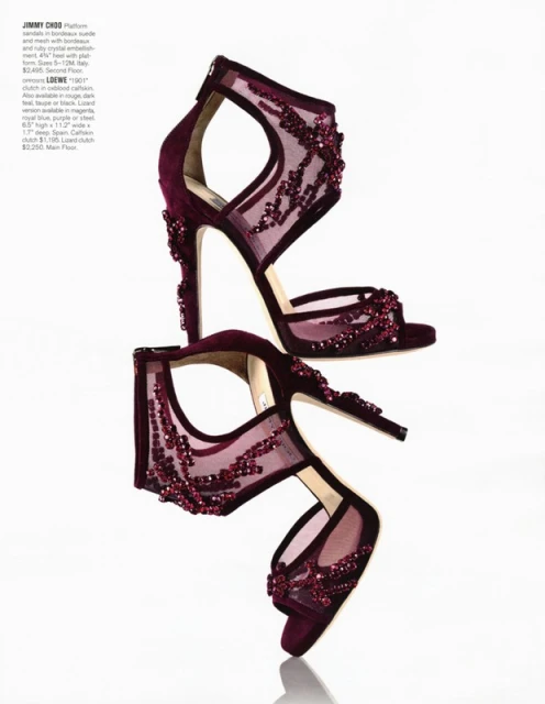 High-heeled Jimmy Choo shoes in shades of dark red and magenta with crystal embellishments displayed on a white surface.