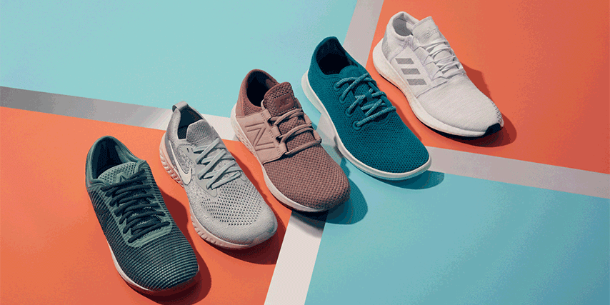 Studio shot featuring five athletic shoes from Nike, Adidas, and New Balance, displayed on a colorful blue and orange backdrop.