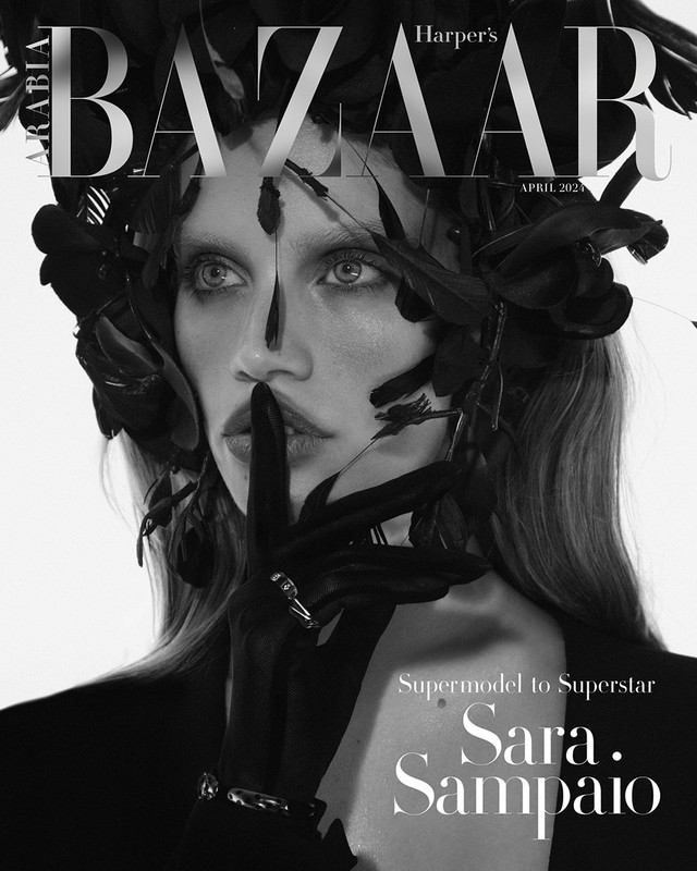 Sara Sampaio covers Harper's Bazaar Arabia in a black and white portrait, accessorized with black gloves and feather embellishments.