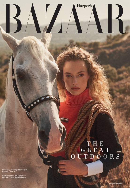 Harper's Bazaar cover featuring a woman in a black and red outfit with a rope, standing next to a white horse in a rural setting.