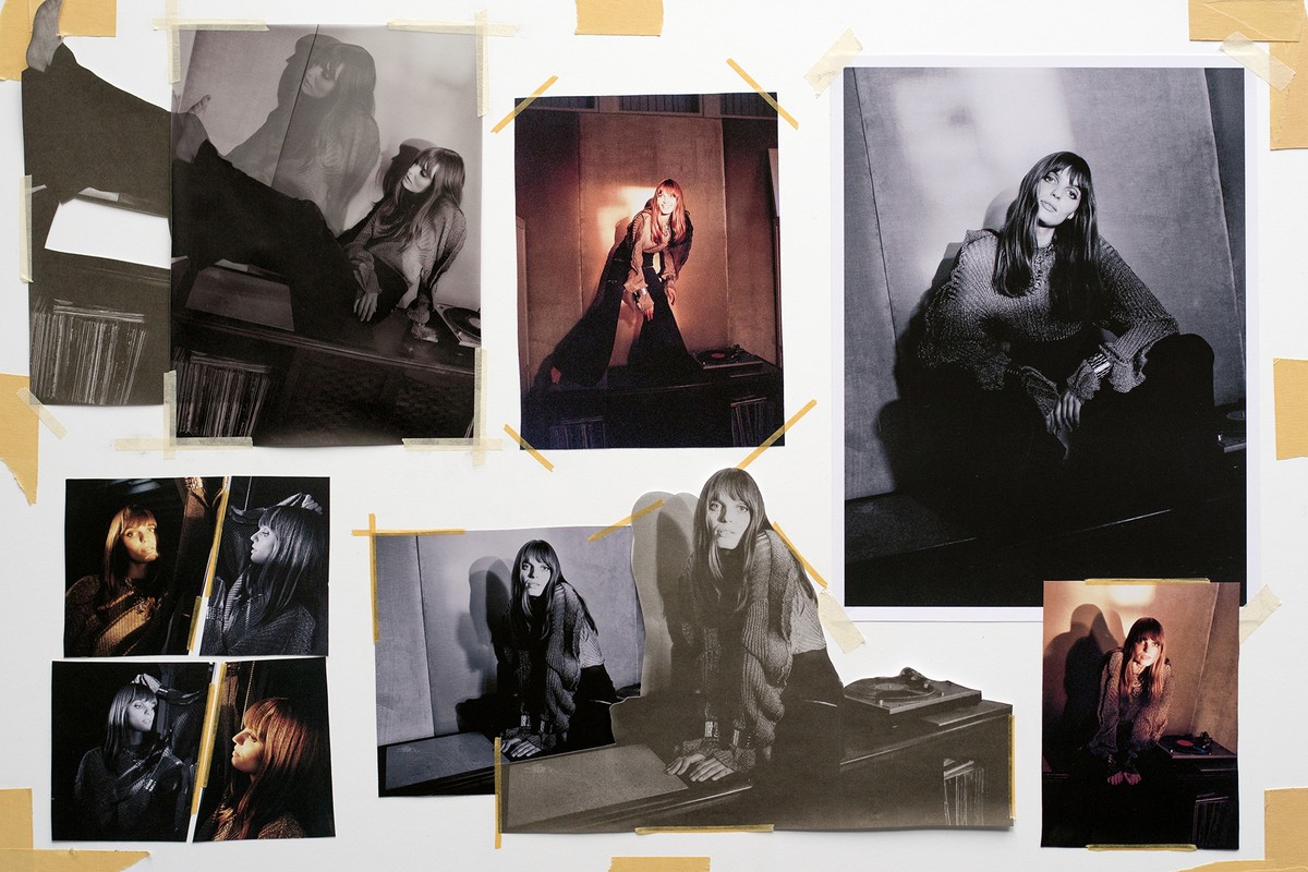Arrangement of photographs showing a female model posing in a photo studio, attached to a white wall with yellow tape.