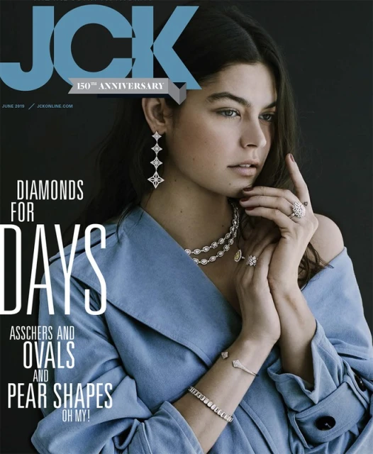 JCK magazine cover featuring a young woman with shoulder-length brunette hair wearing multiple diamond necklaces, earrings, rings, and bracelets.