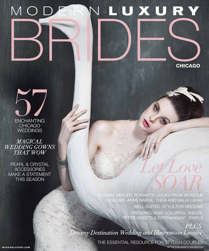 Magazine cover featuring a bride in a wedding dress, embracing a white swan sculpture. Modern Luxury Brides Chicago edition is displayed on the cover.