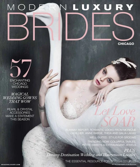 Magazine cover featuring a bride in a wedding dress, embracing a white swan sculpture. Modern Luxury Brides Chicago edition is displayed on the cover.