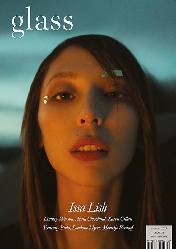 Glass magazine cover featuring Issa Lish, portrait, orange and blue tones, close-up, text overlay. Fashion, beauty, and celebrity aesthetic.