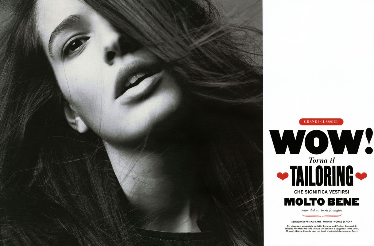 Striking black-and-white fashion editorial of a woman looking up. The composition features a modern layout with dominant typography.