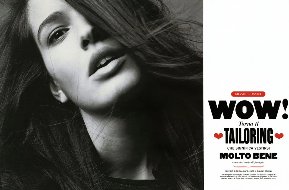Striking black-and-white fashion editorial of a woman looking up. The composition features a modern layout with dominant typography.