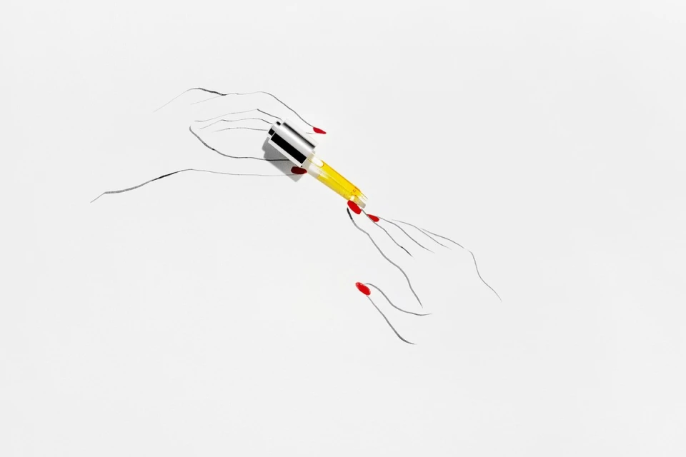 Illustration of two hands with red manicured nails holding a dropper dispensing yellow liquid on a white background, beauty concept.