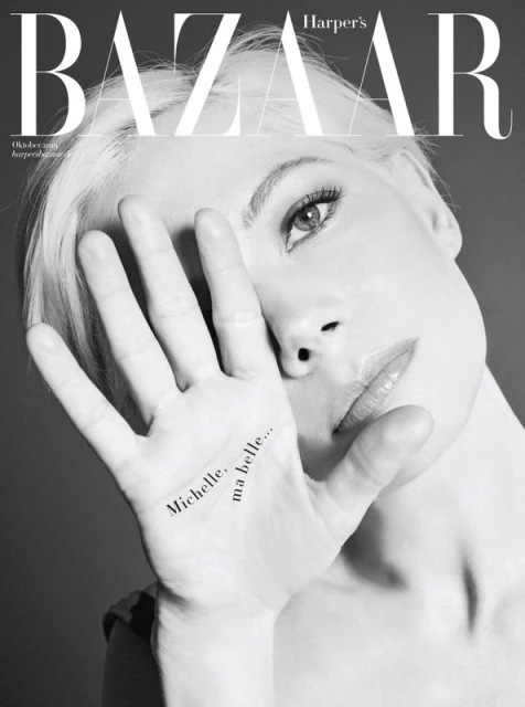 Black and white fashion magazine cover featuring a close-up of a woman with platinum blonde hair and the magazine's logo.