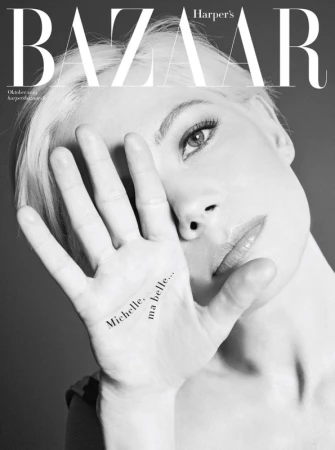 Black and white fashion magazine cover featuring a close-up of a woman with platinum blonde hair and the magazine's logo.