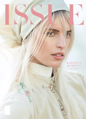 Portrait of a blonde woman wearing a headscarf and patterned cream blouse with make-up by Stefanie Willmann.