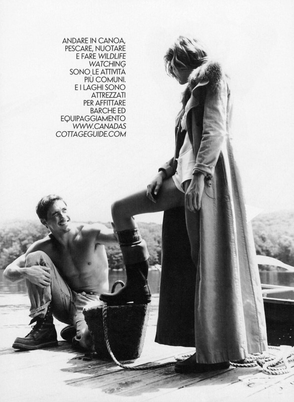 Black and white photograph of a man and a woman on a dock next to a lake, with a woman's leg on a bucket, and text in the background.