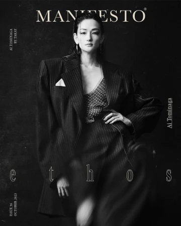 Monochrome fashion portrait of a stylish Asian woman in a pinstripe blazer on a magazine cover with text overlays and black backdrop.
