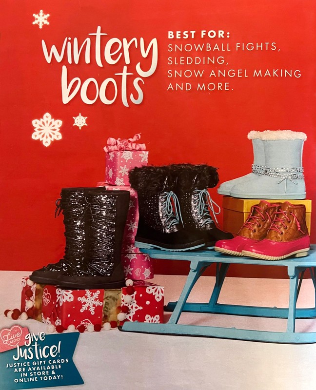 Winter advertisement for Justice brand boots arranged on a blue sled with snowflake wrapped gift boxes on a red background.