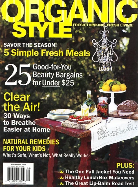 Magazine cover of Organic Style featuring headlines, food, and a chandelier against a green foliage backdrop, promoting fresh living.