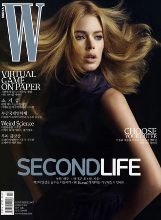 Magazine cover featuring a blond woman with flowing hair, wearing a dark top, with the 'W KOREA' logo and text 'SECONDLIFE'.
