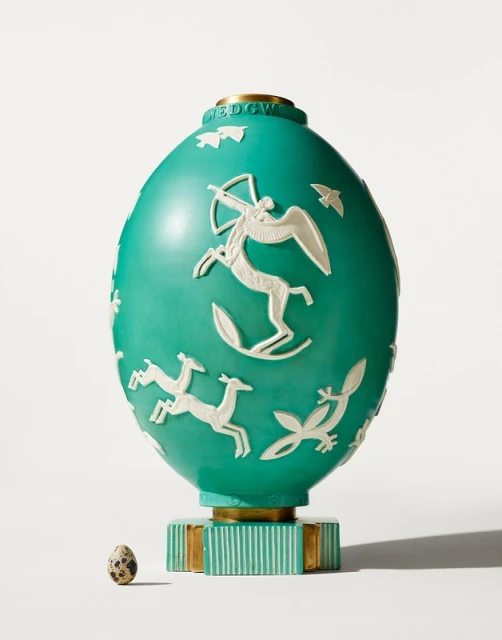 Turquoise Wedgwood Jasperware egg with white bas-relief figures including centaur archer, leaping deer, and birds with small egg