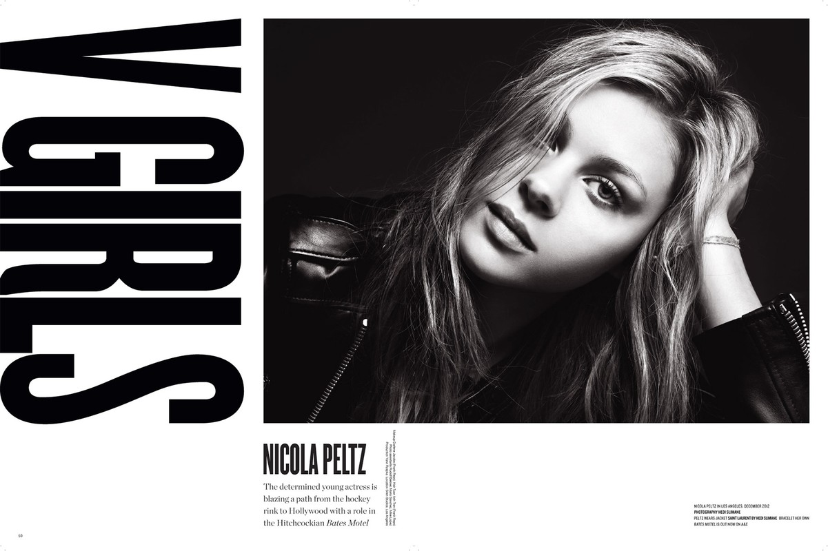Black and white studio portrait of Nicola Peltz wearing a leather jacket, hand on her head, with large black text 'V GIRLS' beside her.