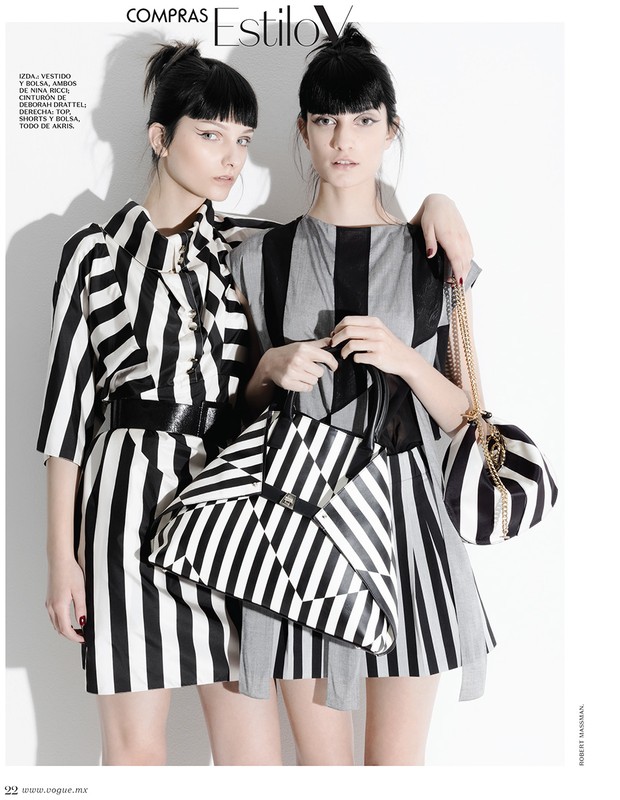 Two women pose in black and white striped dresses with matching handbags, shot in a white studio with magazine text visible.
