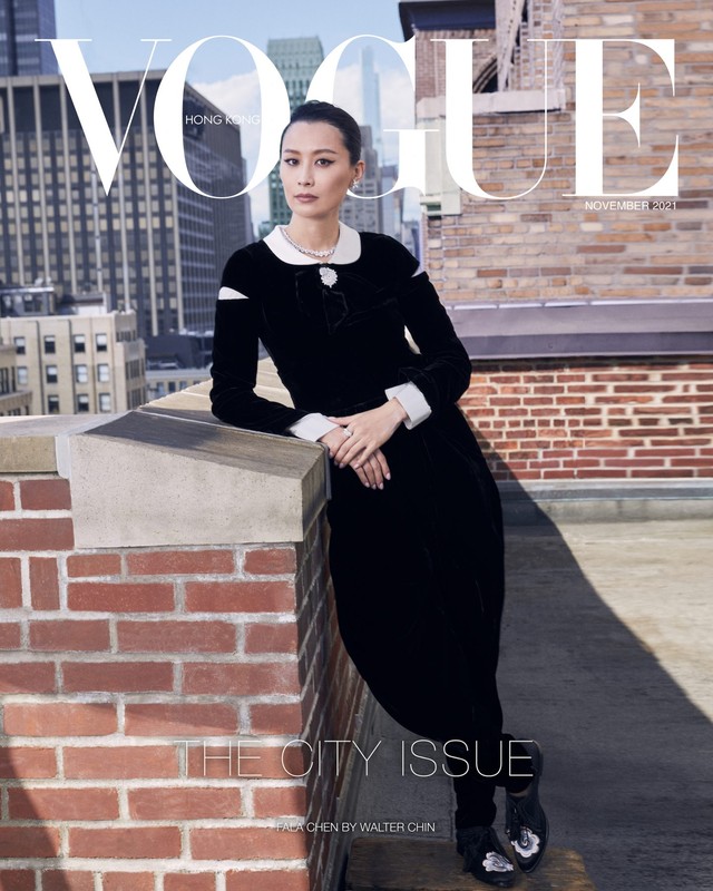 Vogue Hong Kong cover featuring Asian woman in black dress on rooftop with cityscape backdrop. Fashion editorial, city style.