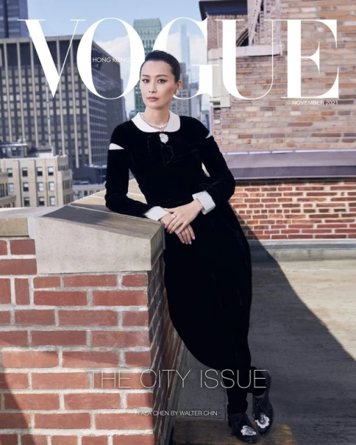 Vogue Hong Kong cover featuring Asian woman in black dress on rooftop with cityscape backdrop. Fashion editorial, city style.