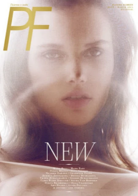 Magazine cover featuring a model with a soft focus and diffused lighting, highlighting fashion and beauty elements.