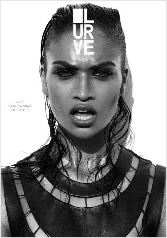 Monochrome fashion cover featuring a striking woman with wet hair wearing a geometric leather top against a bright white backdrop.