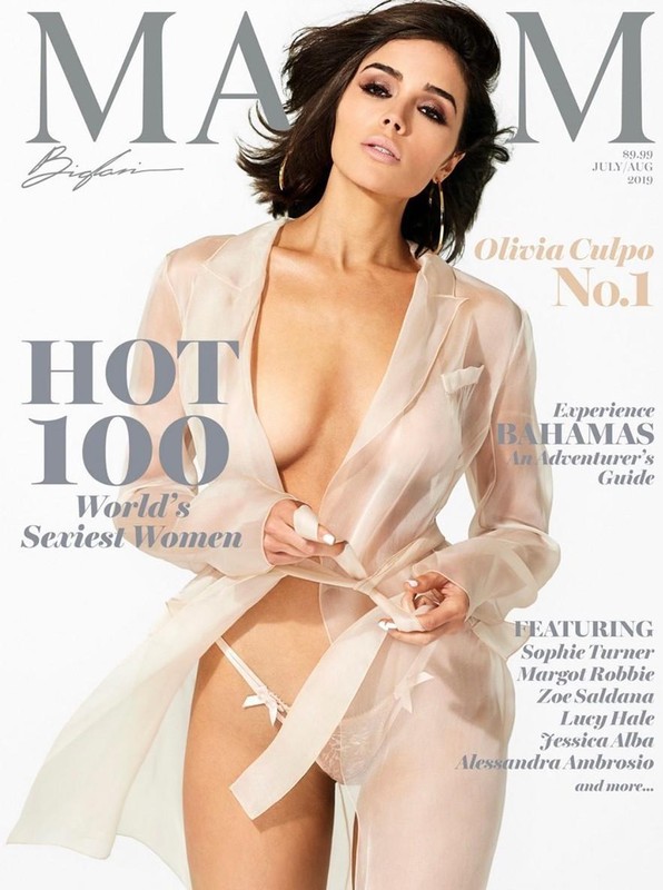 Olivia Culpo on Maxim magazine cover July/August 2019. She is wearing a sheer white robe and lingerie against a light backdrop.