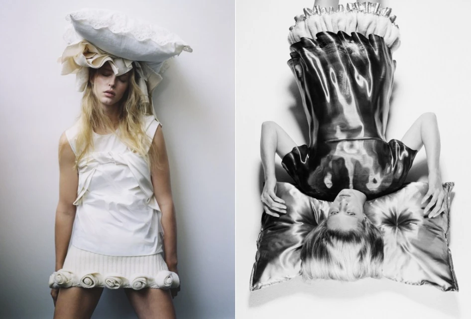 Monochrome fashion shot of a woman in a white dress and pillows on her head and shoulders; a second woman in a black dress upside down.