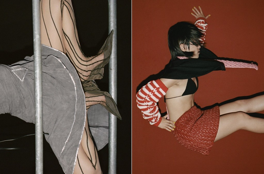 Fashionable woman poses in a miniskirt and knit top with striped tights and heels against red and dark backgrounds.