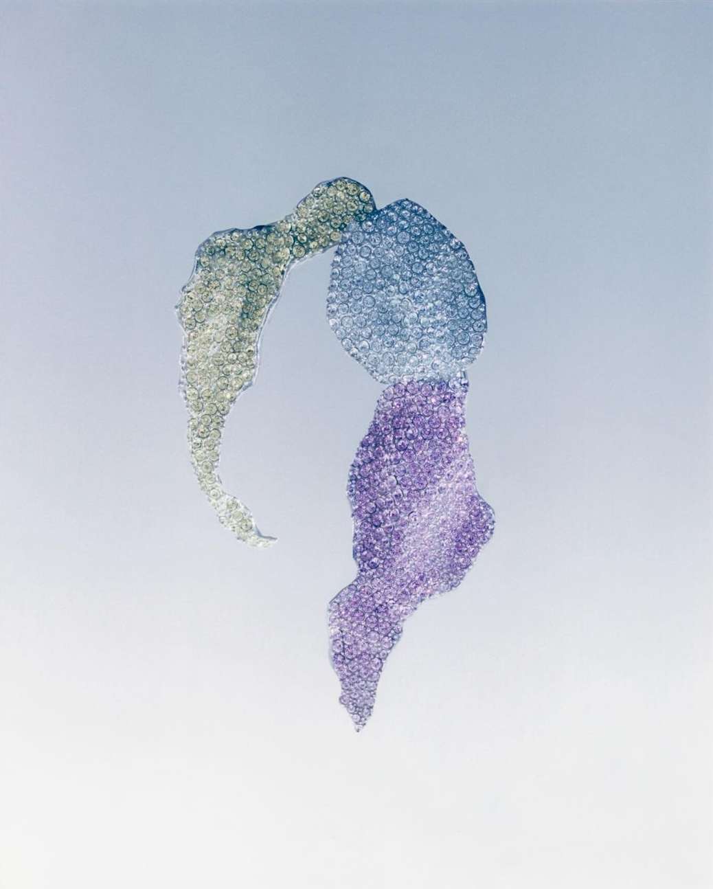 Abstract image features swirling purple, blue, and silver textures against a light background, creating a visually fluid design.