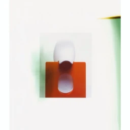 An abstract composition showing a white object overlapping a vibrant orange rectangular surface against a white background.