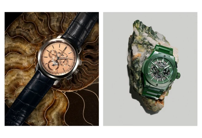 Two luxury wristwatches are displayed: one with a blue leather band on a spiral fossil, and another with a green band on a rock.
