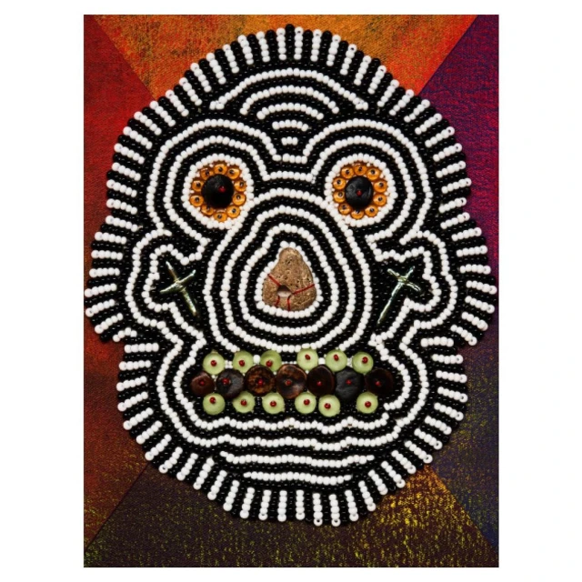 Artistic skull decoration with beads, stones, and cross shapes on colorful textured background. Halloween and Day of the Dead themed image.