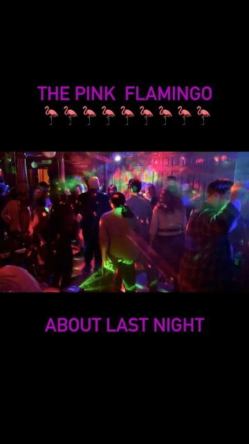A group of people are dancing in a nightclub with colourful lighting, creating a vibrant and energetic atmosphere.