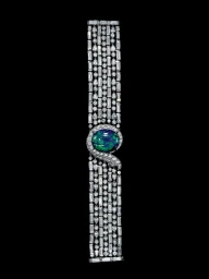 Diamond bracelet featuring a central dark blue-green opal stone photographed by Carlton Davis against a black background