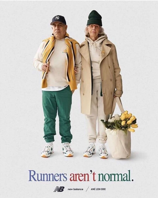 Older couple poses in athletic wear with tote bag and flowers in a studio shot, with "Runners aren't normal" headline.