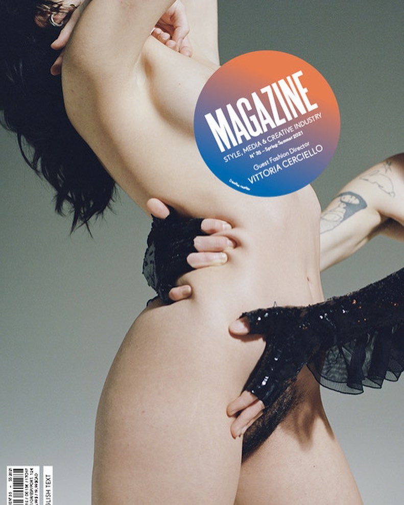 Magazine cover featuring a woman partially obscured by hands and a circular graphic, highlighting fashion and creative industry themes.