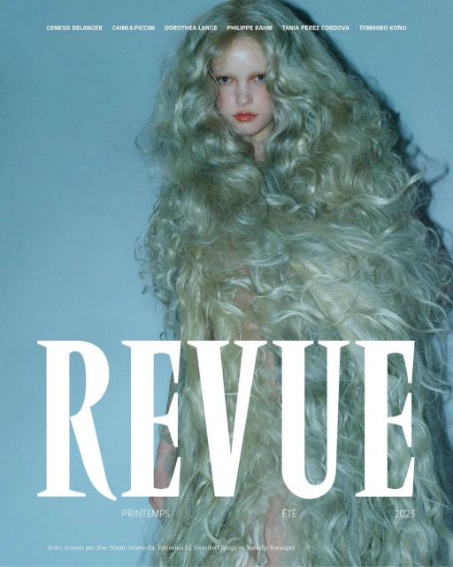 Fashion magazine cover featuring a woman with voluminous, pale blonde hair and neutral makeup against a soft blue backdrop. Revue Spring/Summer 2025.