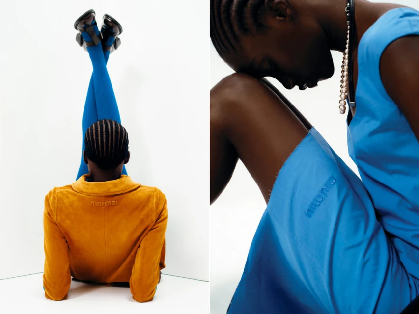 Fashion shot featuring two African women; one in a yellow jacket and blue leggings, the other in a blue dress with a matching necklace. The scene is set indoors.