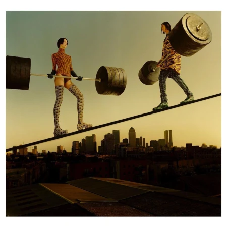 Two figures balance on a tightrope between buildings in a cityscape, holding heavy barbells. The artistic image highlights balance and strength.