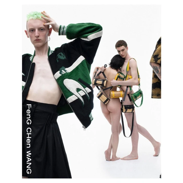 Fashion-forward editorial shot featuring androgynous models showcasing clothes and accessorized with multiple small bags in a studio setting.