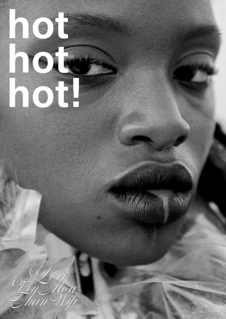 Close-up black and white portrait of an African-American woman with glossy lips, featuring visible text that reads, “hot hot hot!”.