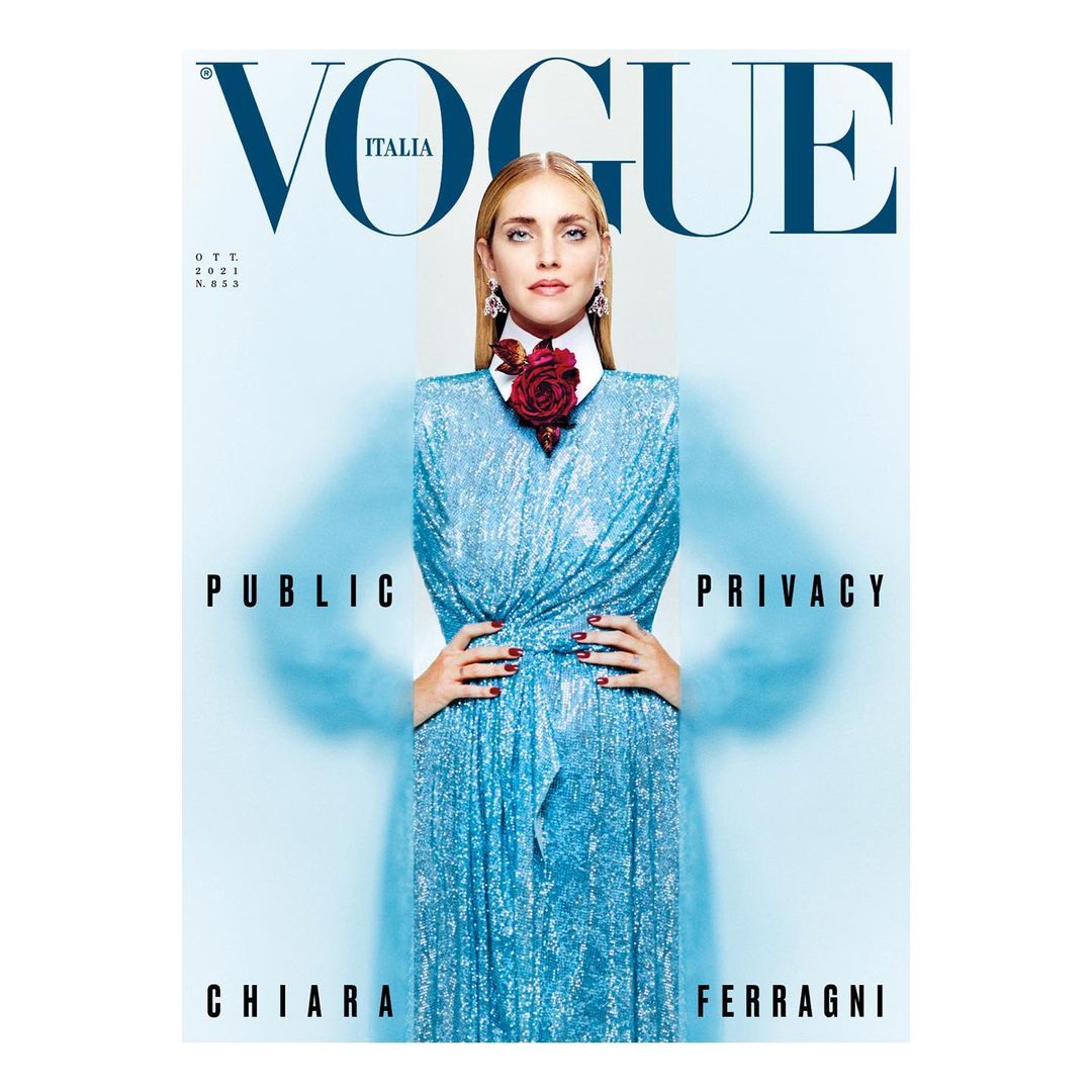 Vogue Italia cover featuring Chiara Ferragni in a blue dress with a red floral embellishment, captured in a studio shot with bold typography.