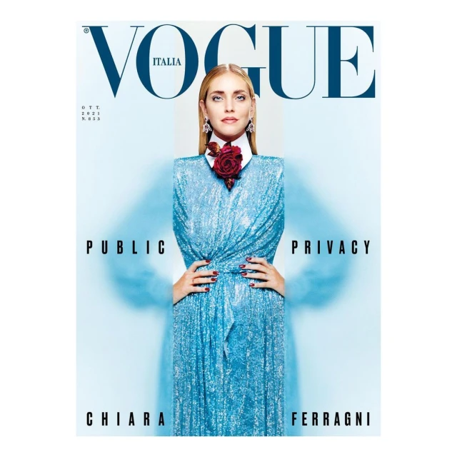 Vogue Italia cover featuring Chiara Ferragni in a blue dress with a red floral embellishment, captured in a studio shot with bold typography.