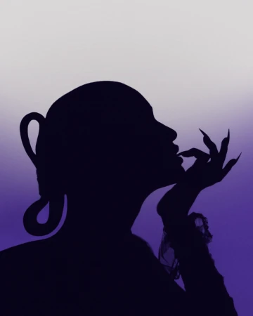 Silhouette of woman with dramatic nail extensions and updo hairstyle against purple and white gradient background.