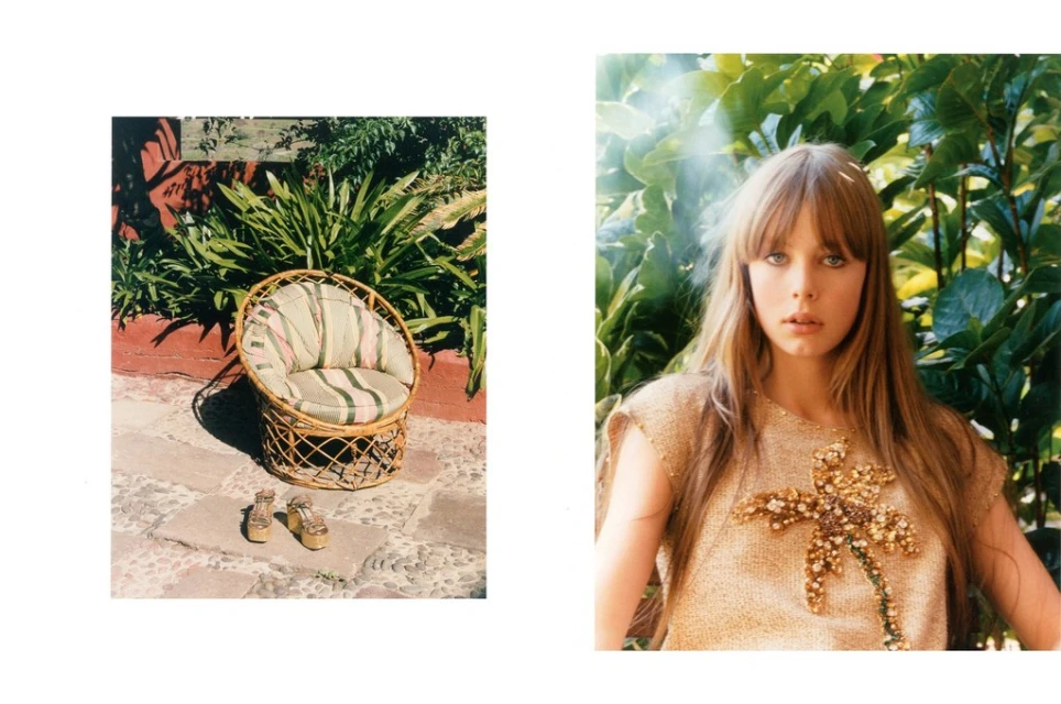 Outdoor image featuring a young woman in a tan top with a palm tree design, complemented by a wicker chair and gold platform shoes.