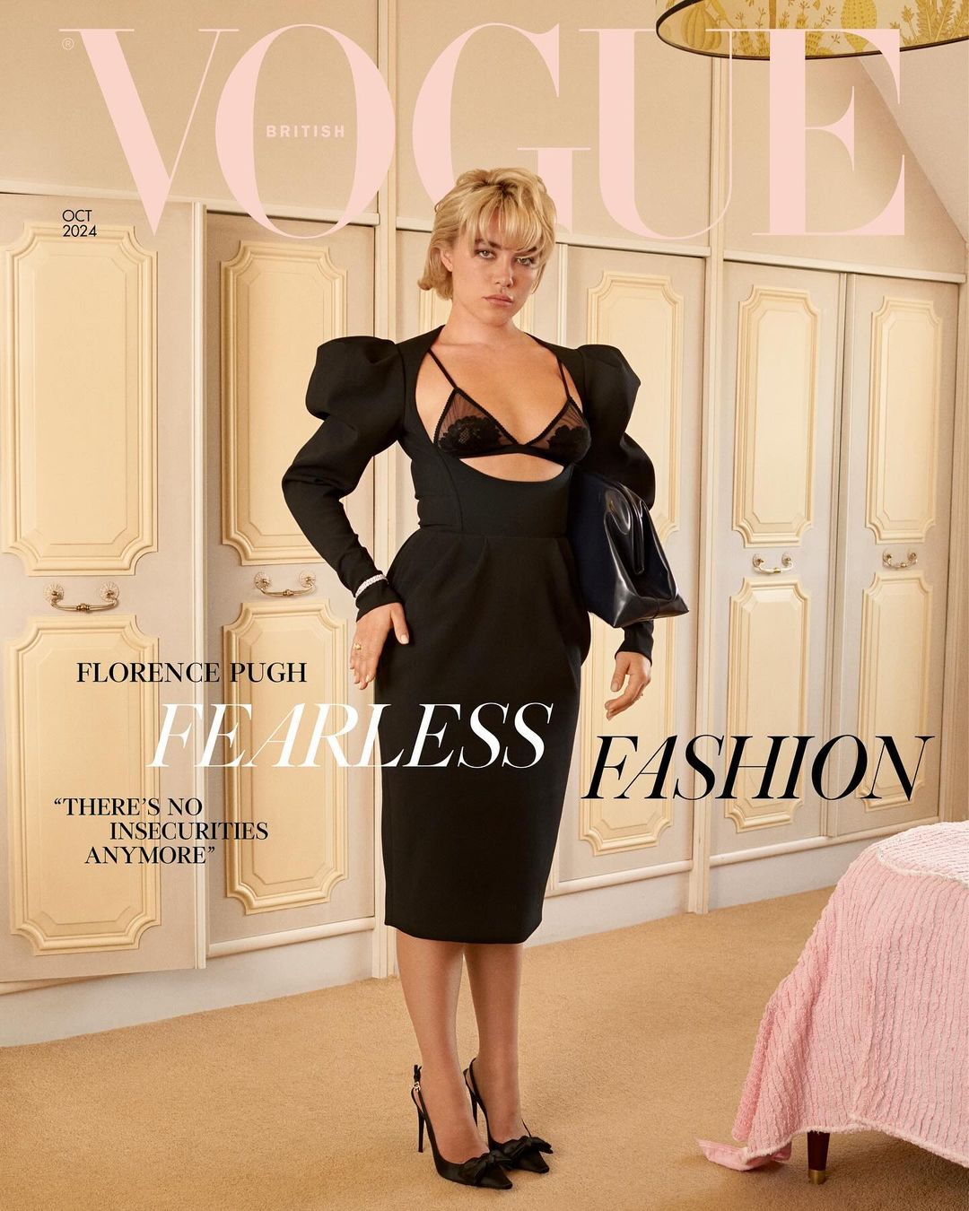 Florence Pugh poses on the cover of British Vogue, October 2024 issue, wearing a black dress and heels, holding a black handbag indoors.